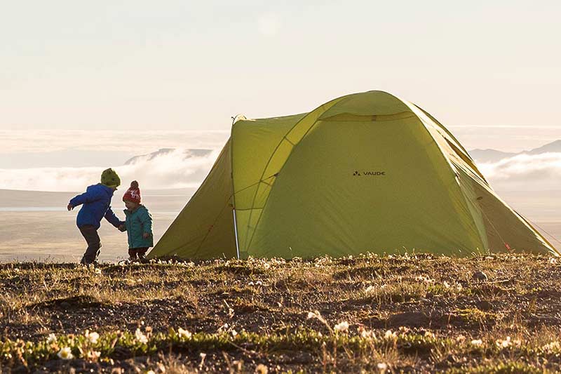 kids in front of a tent